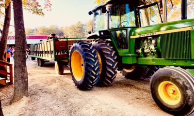 4430 Wagon Ride a tractor parked in the dirt