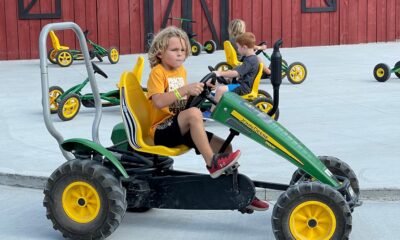 Pedal Kart Kids a group of people sitting on a motorcycle